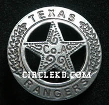 A silver circle star badge with the word "Texas" at the top of the circle and "Ranger" at the bottom. In the center of the star is the words "Co. A". There are leaves up the side of the circle and swirls in the middle of the star. Across the bottom of the image is the website "circlekb.com".