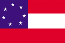 A flag with three thick horizontal stripes in red, white, and red. There is a dark blue square in the upper left hand corner with a circle of 7 white stars.