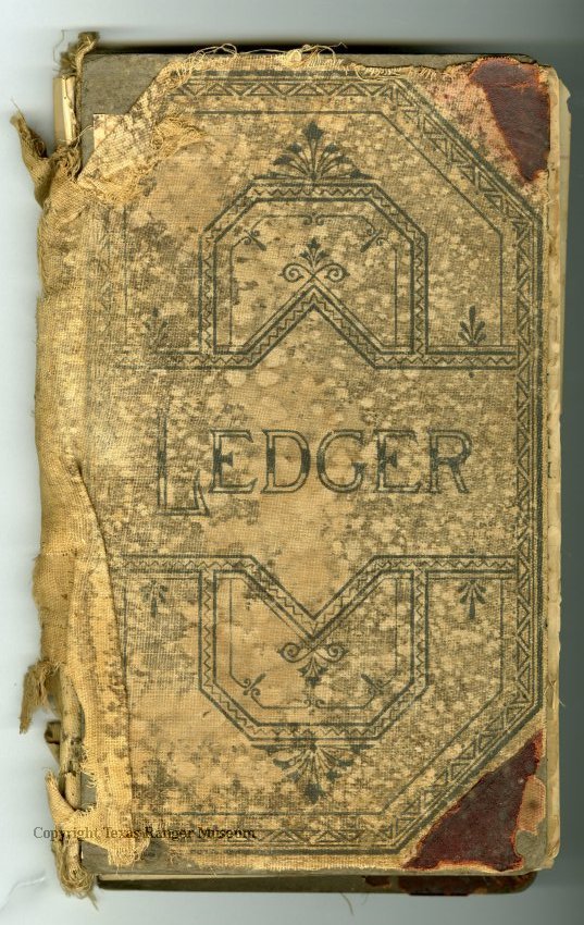 An old tan colored book in tattered condition with a dark blue/black geometric design on it and the word "Ledger"