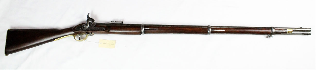 long rifle made of dark wood and silver metal