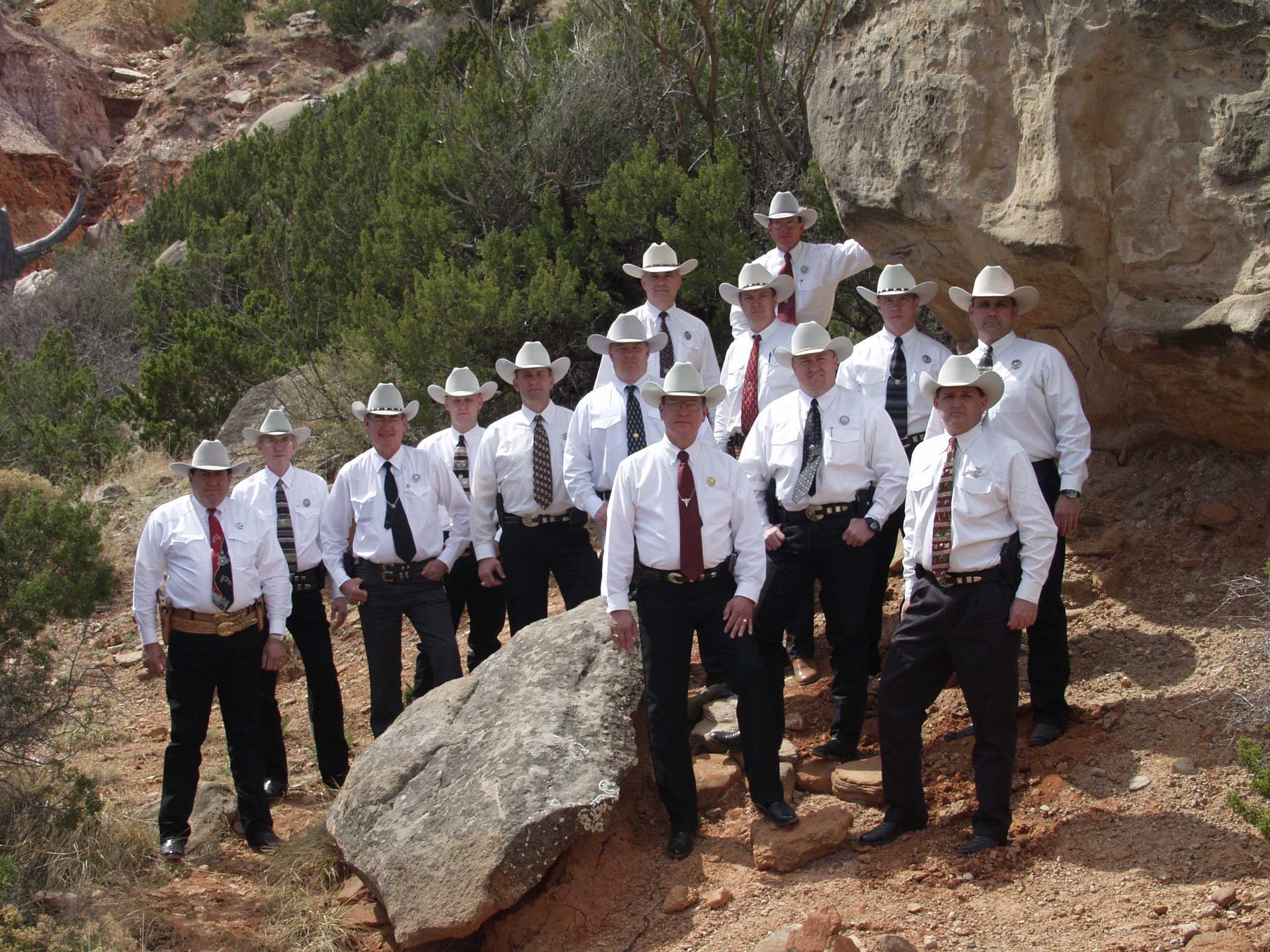 14 men in Ranger uniforms on mountain area